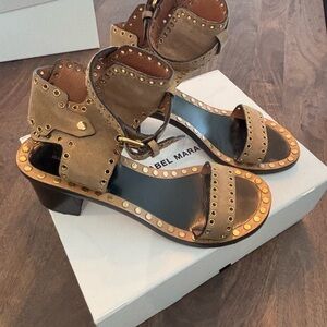 Isabel Marant Jaeryn sandals are embellished with gold studs.